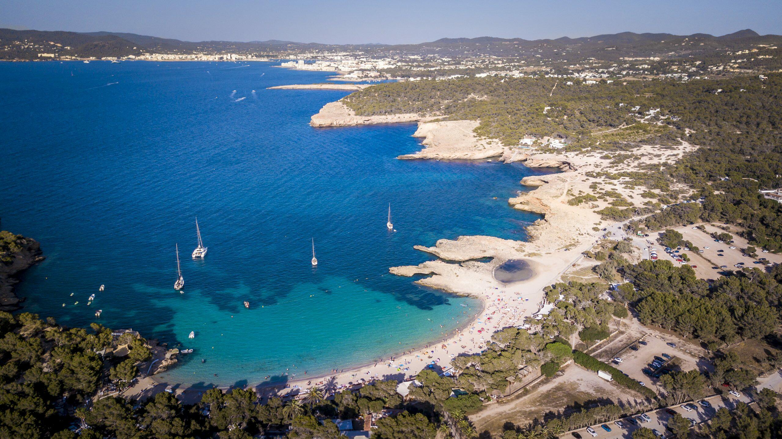 Aerial view of Cala Bassa in Sant Josep de sa Talaia, Ibiza, with sailboats and a sandy beach